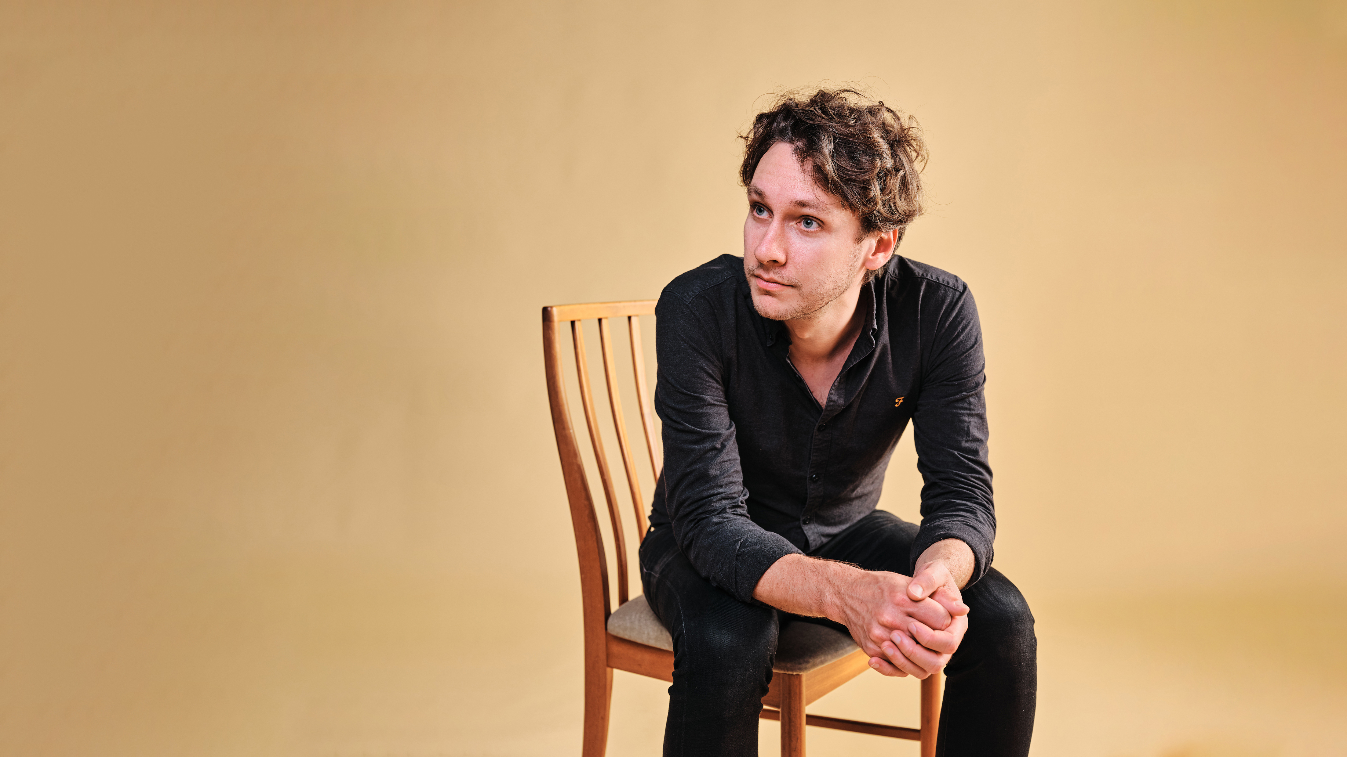 A photo of Tom Hyatt on a chair